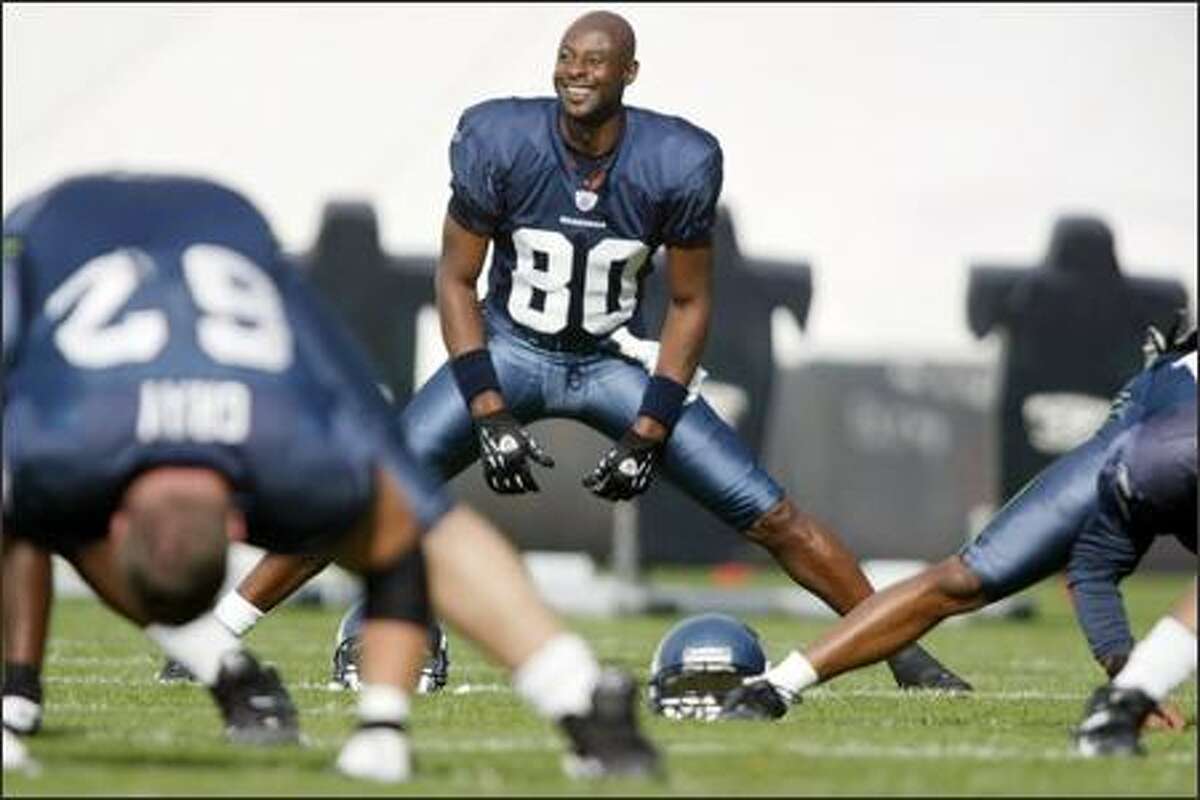 Seahawks' Jerry Rice stretches with his new team during practice in Kirkland. Rice, 42, the NFL career leader in receptions (1,524), receiving yards (22,533) and receiving touchdowns (194), joined the Seahawks on Tuesday from the Oakland Raiders. (Seattle Post-Intelligencer, Joshua Trujillo)