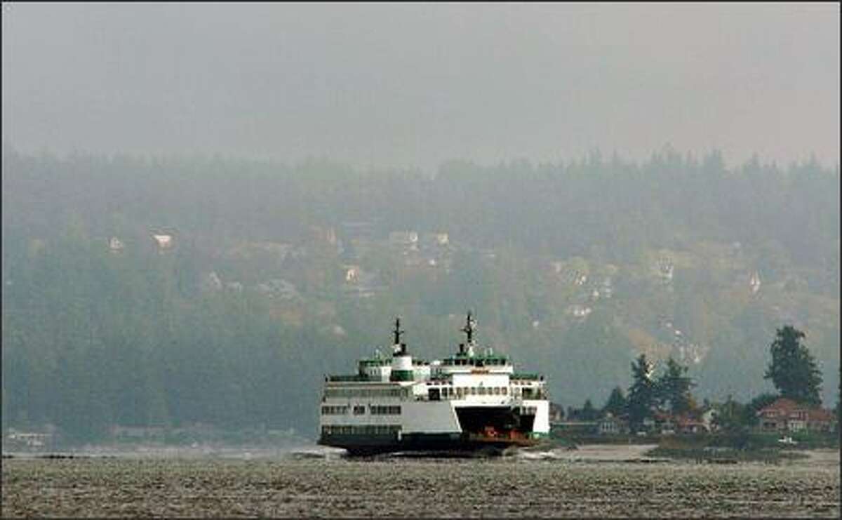 The Washington State Ferry Kitsap pulls into the busy Bremerton dock.