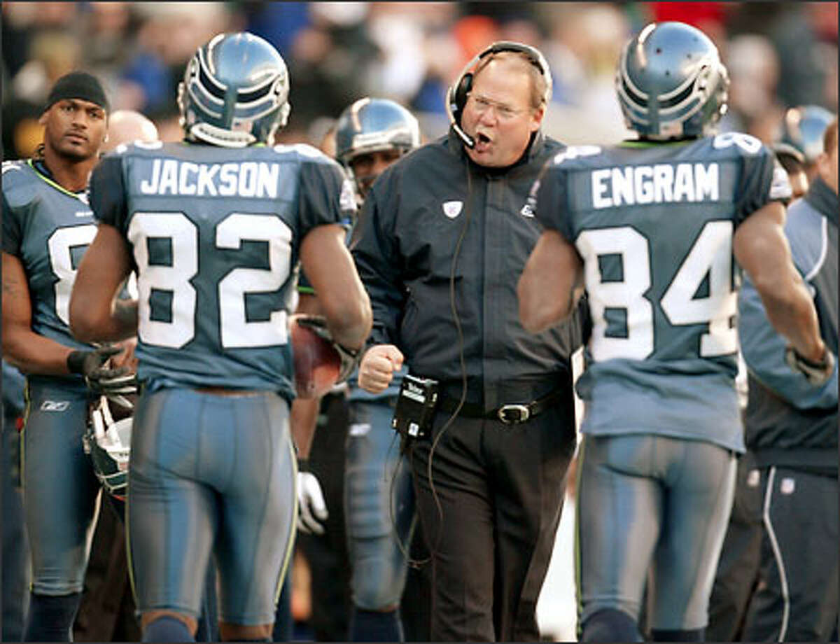 Seahawks coach Mike Holmgren welcomes Darrell Jackson to the sideline after the receiver's 14-yard TD catch gave Seattle a 16-6 lead on Sunday, Nov. 2. Jackson had five catches for 85 yards.