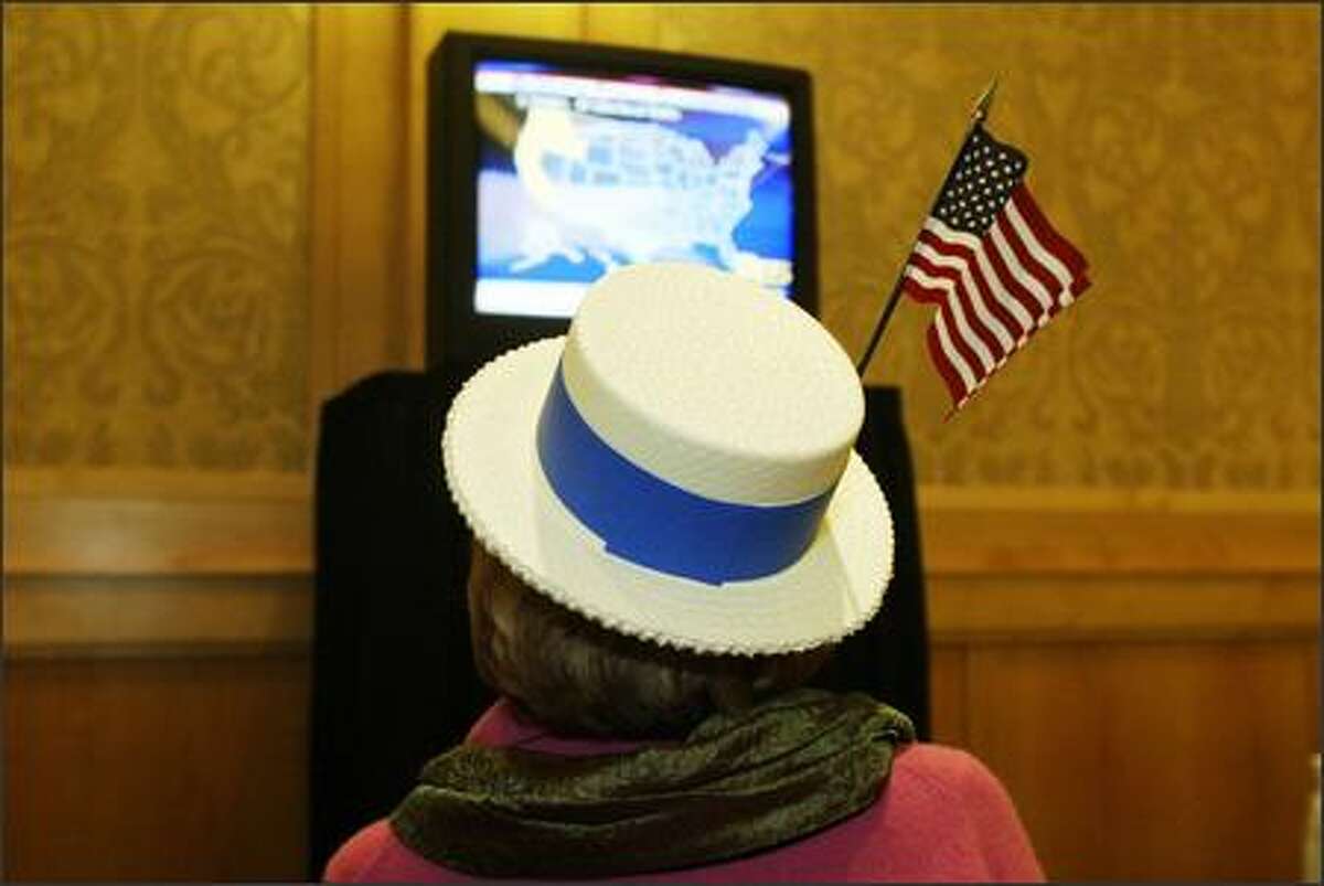 Stephanie Doran of Kirkland watches national results at the Democratic election night party at the Westin Hotel.