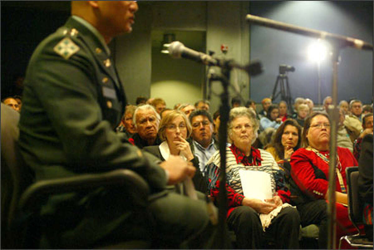 Capt. Paul Robson takes the witness stand during an exoneration trial for Chief Leschi of the Nisqually Indian Tribe at the Washington State History Museum, in front of two rows of witnesses. More than 150 years after he was convicted and hanged for killing a militia man in Washington Territory, Leschi was cleared of the murder charge.