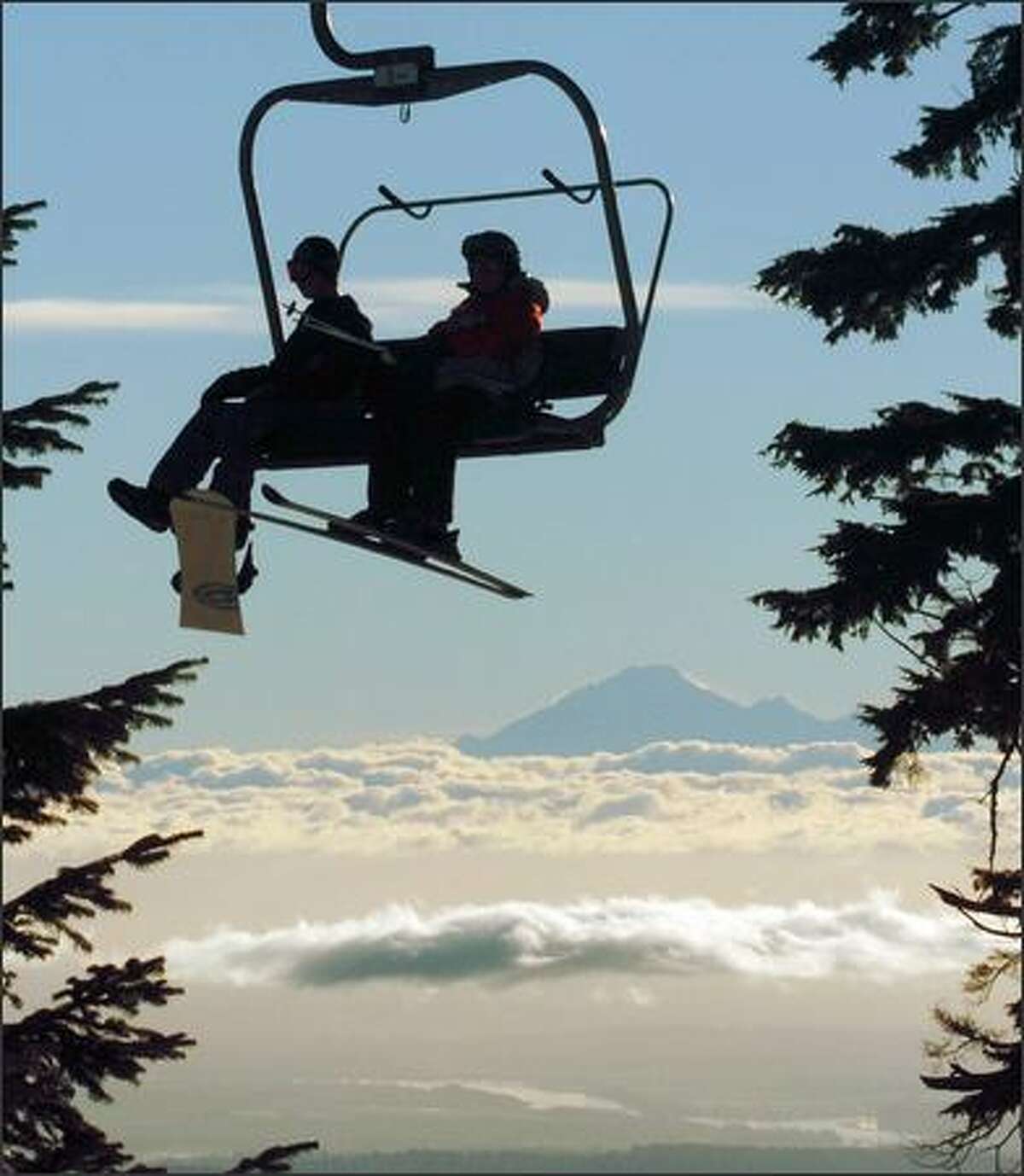 Early morning skiers at Grouse Mountain get a spectacular view of Mount Baker in Washington.