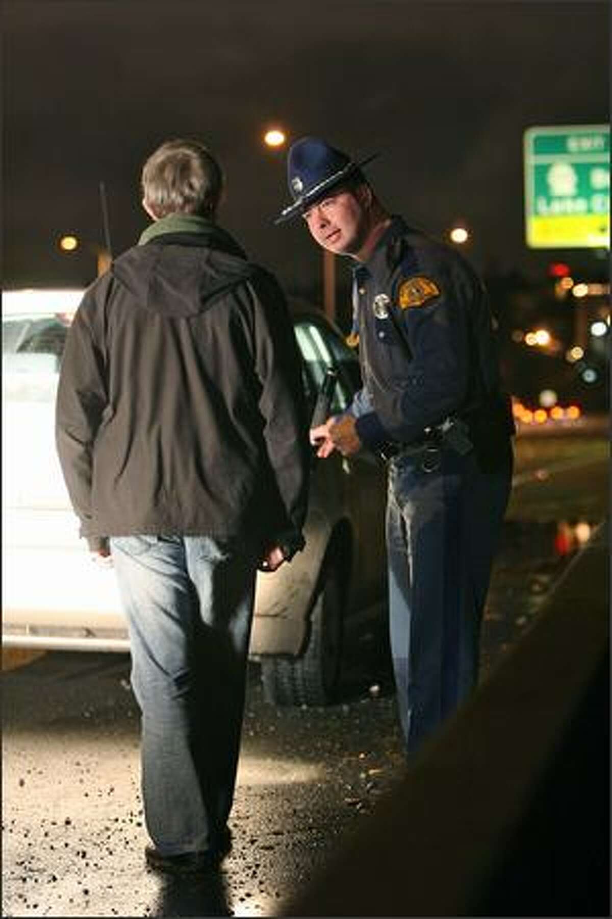 Washington State Patrol Trooper Joe Gannon administers a field sobriety test to a suspected drunk driver he pulled over on Interstate 5. The driver later blew a .156, almost double the legal limit, on the breath analyzer.