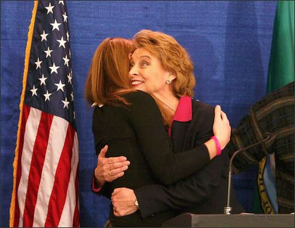Gubernatorial candidate Christine Gregoire hugs her daughter, Michelle, in Seattle after the state Supreme Court ruled that 735 disputed King County ballots can be reviewed.