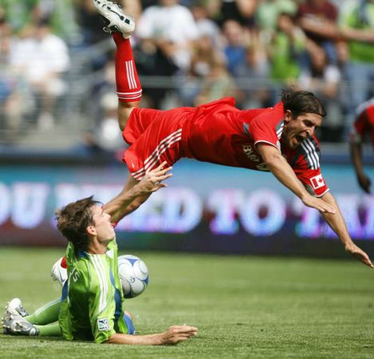 Seattle Sounders player Brad Evans and Toronto FC player Nick Garcia tangle near the Sounders' goal on Saturday August 29, 2009 in the second half of a match at Qwest Field in Seattle.