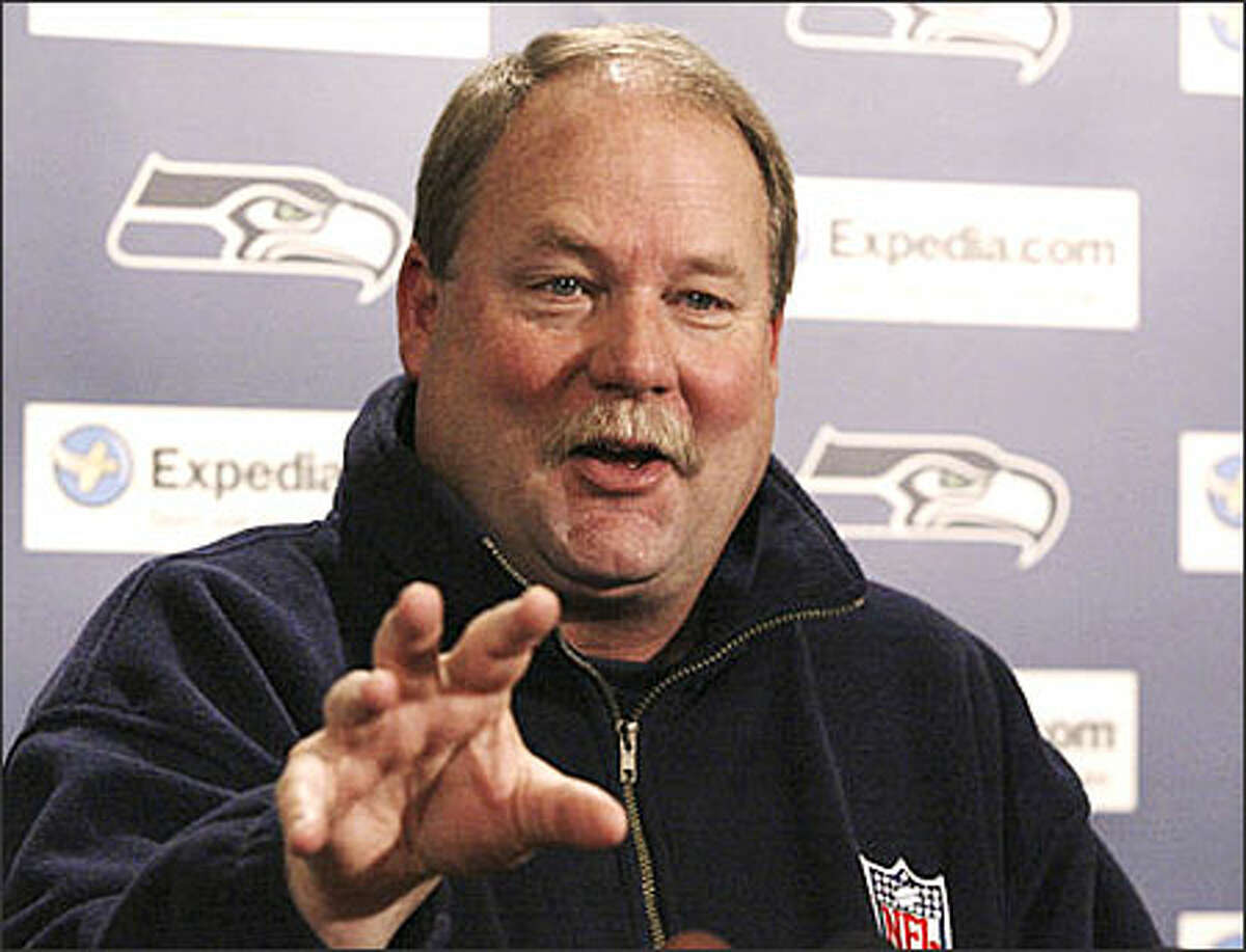 Seattle Seahawks coach Mike Holmgren speaks during a news conference at Seahawks headquarters in Kirkland Tuesday. Holmgren will continue as coach of the Seahawks but relinquish his role as general manager of the team, Seahawks president Bob Whitsitt said.