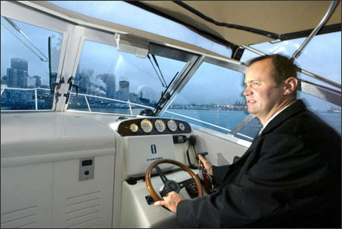 Parker Ferguson, en route from his Bainbridge Island home, points his powerboat toward Bell Harbor Marina, which is near his downtown office.