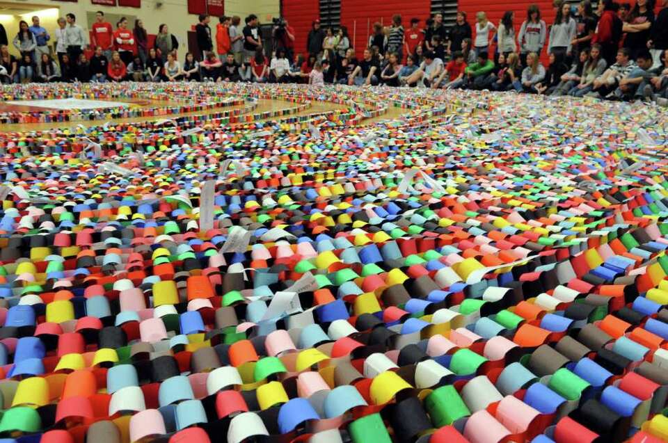 Masuk students construct record-breaking pi paper chain