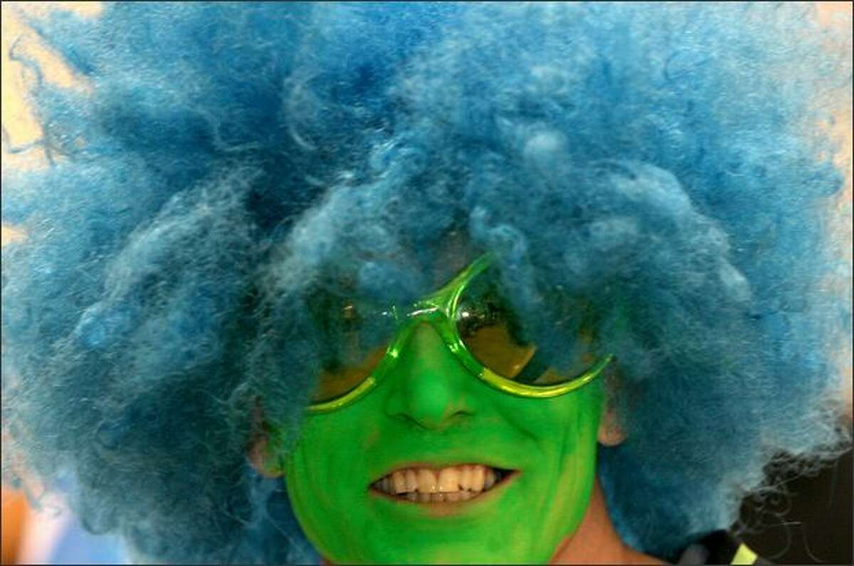 Maybe he should have gone for a mo-Hawk: Season ticket holder Greg Kockritz sports a blue wig and green face paint as he attends a Seahawks pep rally at Qwest Field on Friday.