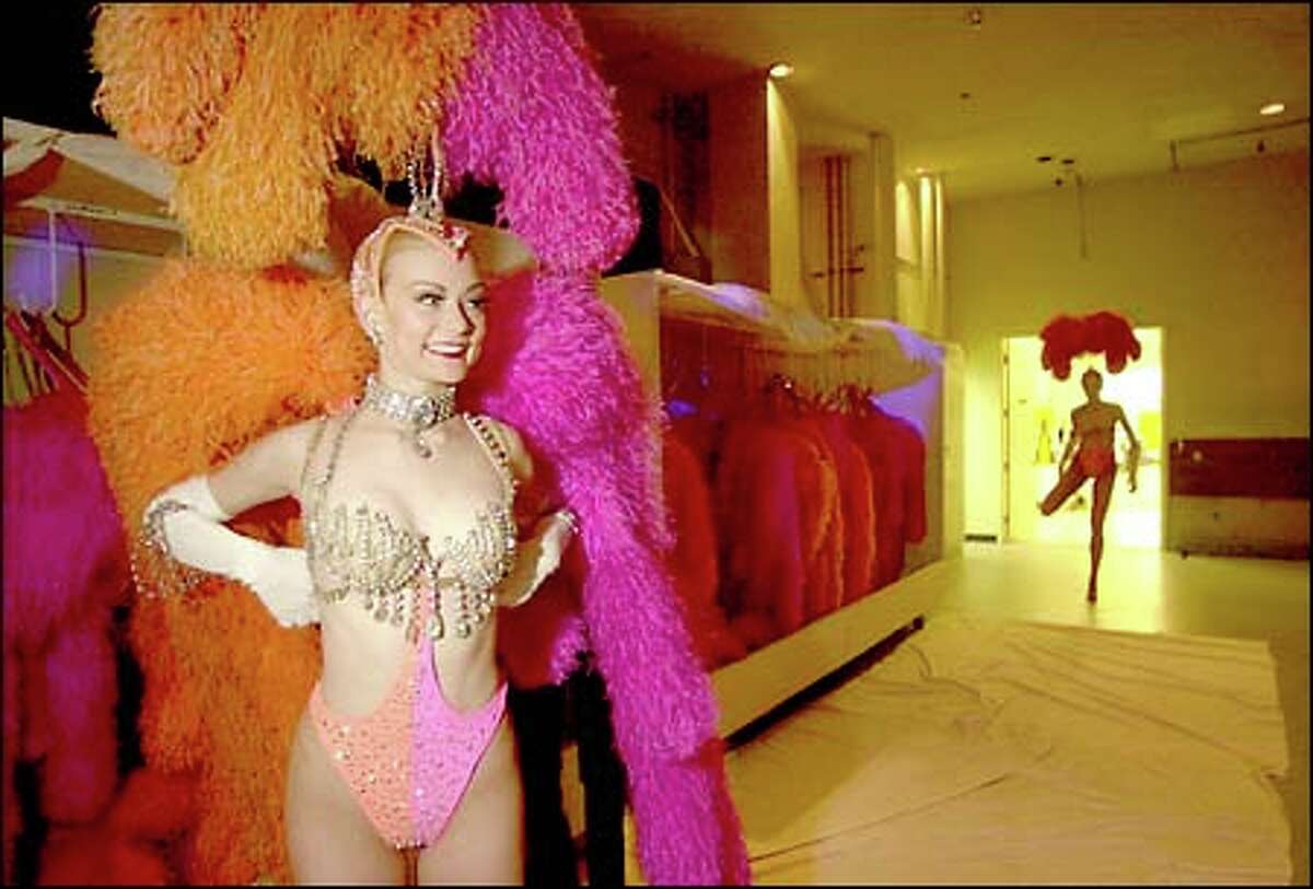 Ann Jung puts on her feathers for "Jubilee" at Bally's Hotel. Decades after the showgirl became a Las Vegas icon, only two major productions remain.