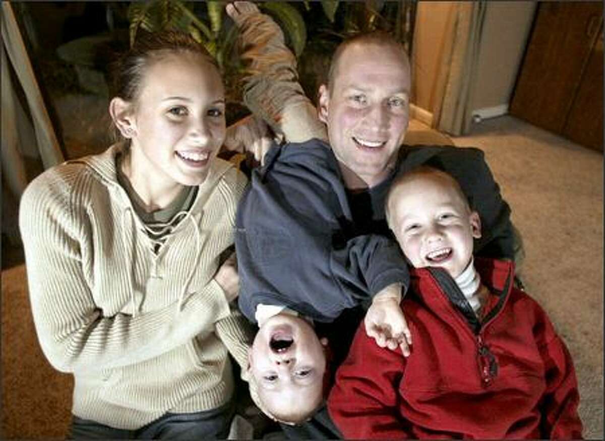 Christian Welp, retired from basketball, relaxes with daughter Allison, 13, and sons Nicholas, 1, and Collin, 5.