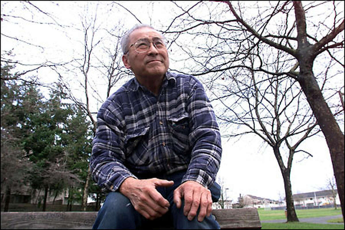 Kazuo Ishimitsu, 73, sits on the former site of Washington Junior High School, where he went to school before he was interned during World War II.