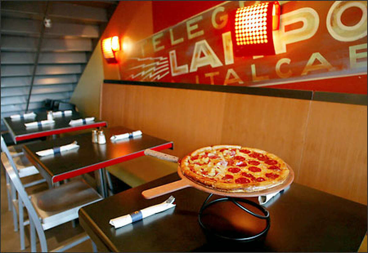 Pagliacci Pizza's first sit-down restaurant has opened in Bellevue Square, creating a comfortable if spartan space in a niche next to Crate and Barrel.