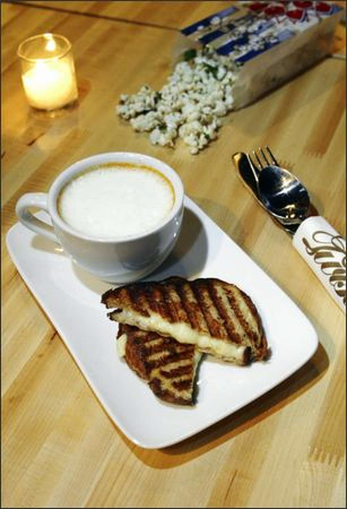 Tomato Cappuccino at Oliver's Twist is a creamy homemade soup served with a grilled cheese on toasted brioche.