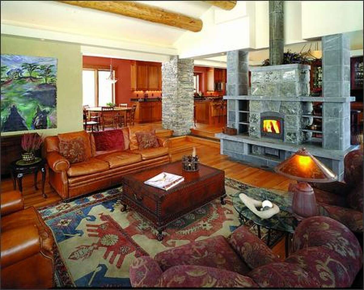 This large masonry fireplace doubles as a room divider and radiates heat to a very large area. (RON PIHL)