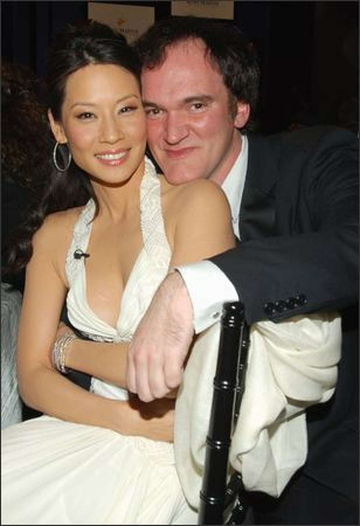 This is not part of an audition for the latest version of "Beauty and the Beast." Instead, actress babe Lucy Liu and chinmaster director Quentin Tarantino mug for the lens at the Asian Excellence Awards recently in L.A. where the two "Kill Bill" vets each received an award.