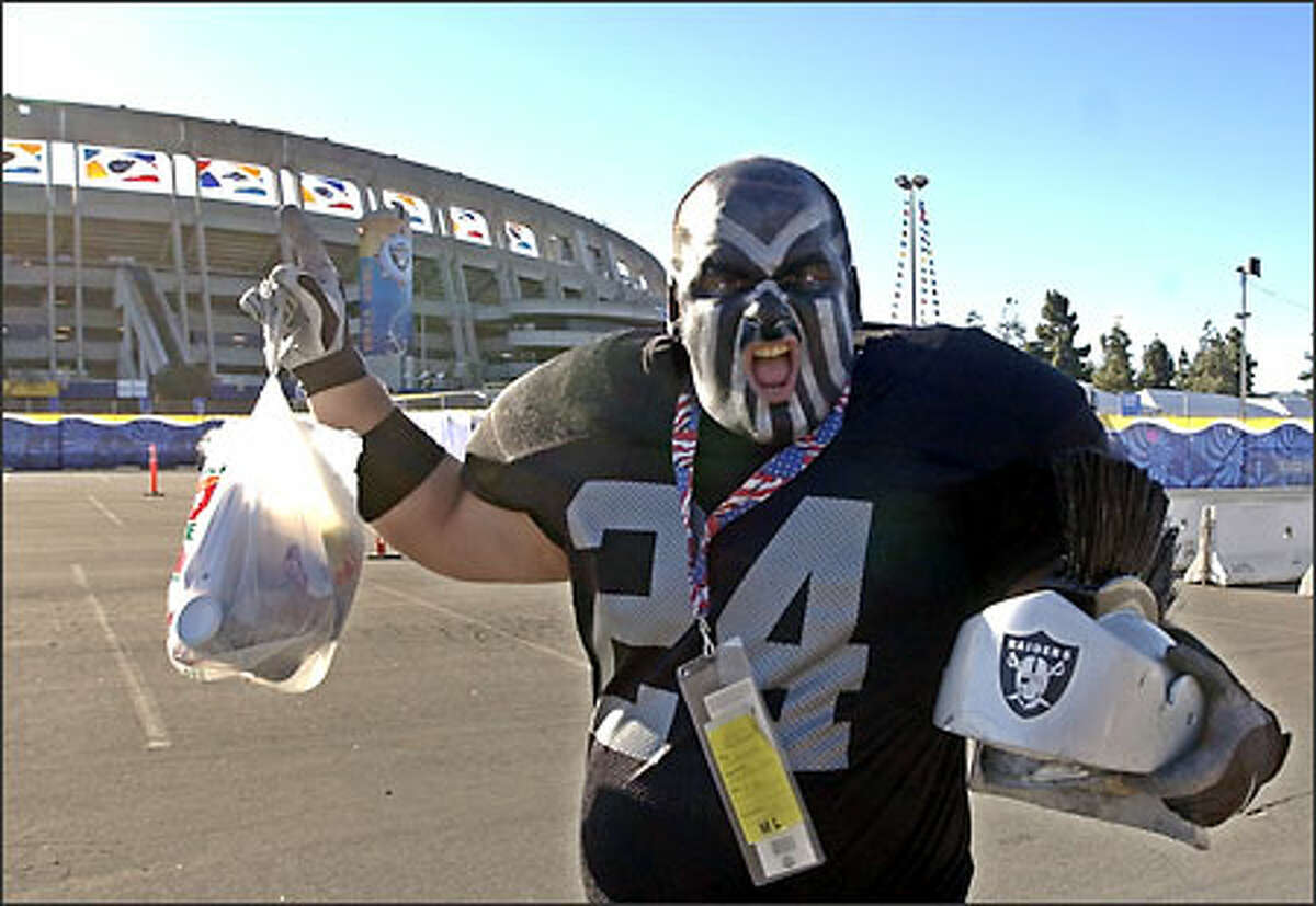Joe Tuccinardi of Camino, Calif., wears his Glad-a-Raider costume as he arrives at Qualcomm Stadium for Super Bowl XXXVII in San Diego. The Oakland Raiders will play the Tampa Bay Buccaneers.