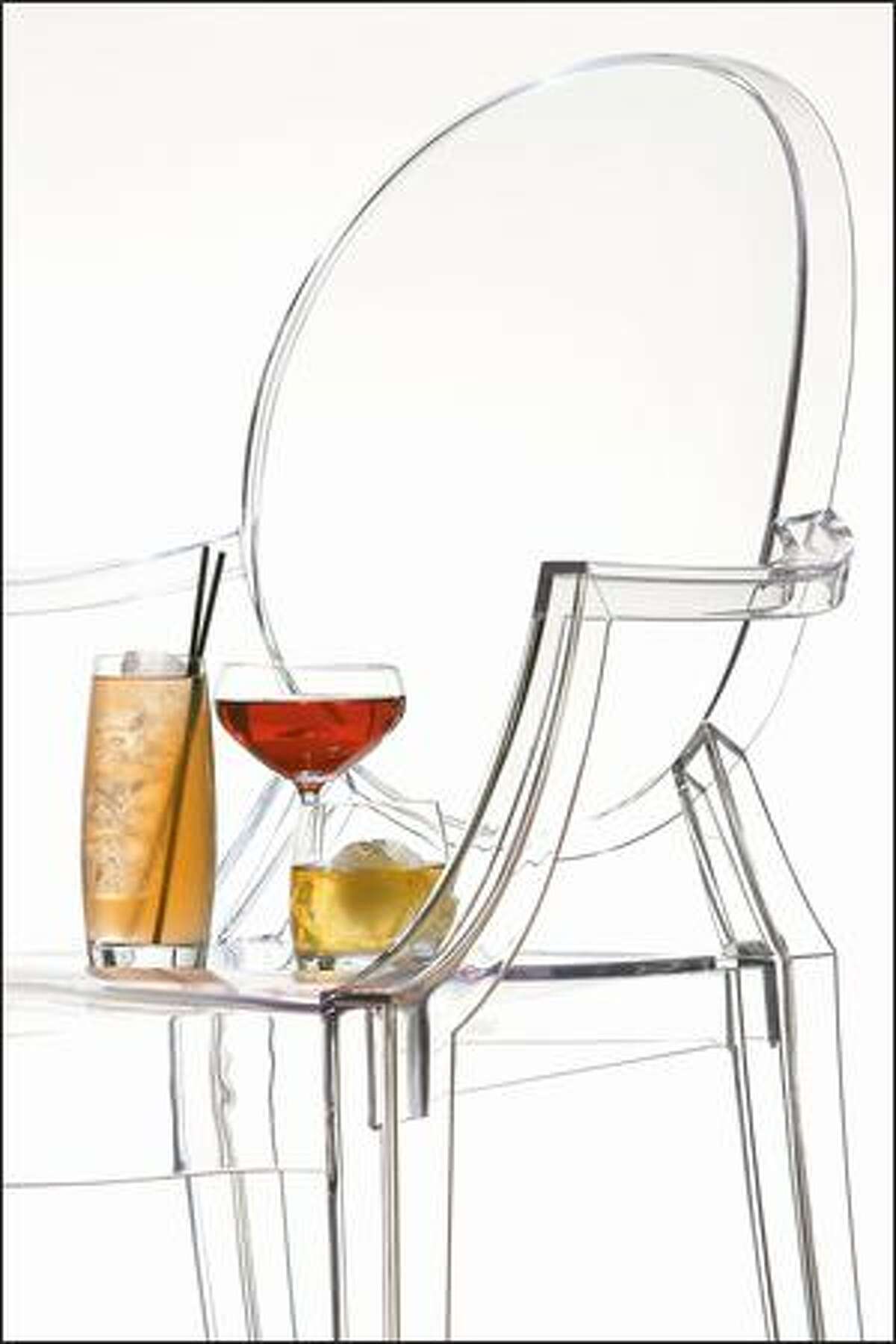 A sleek, clear chair supports a Ginger-Apple Buck, a Bobby Burns and Woodford Reserve. Vessel's cocktails are precisely crafted and sourced by bar manager Jamie Boudreau.
