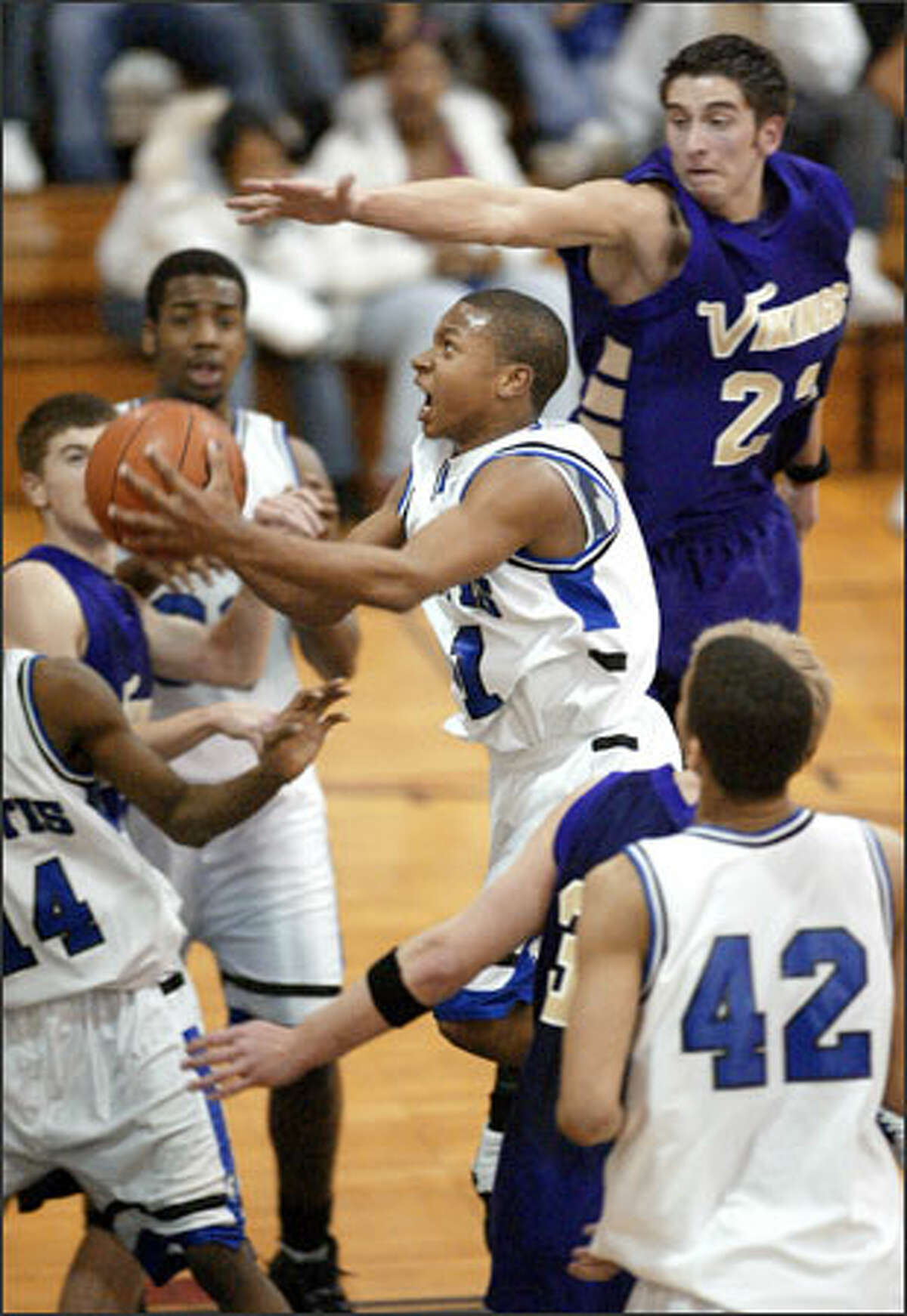 Curtis sophomore Isaiah Thomas drives past Puyallup's Austin Kilpatrick during their SPSL game Tuesday. Thomas scored 22 points in a 55-43 victory.