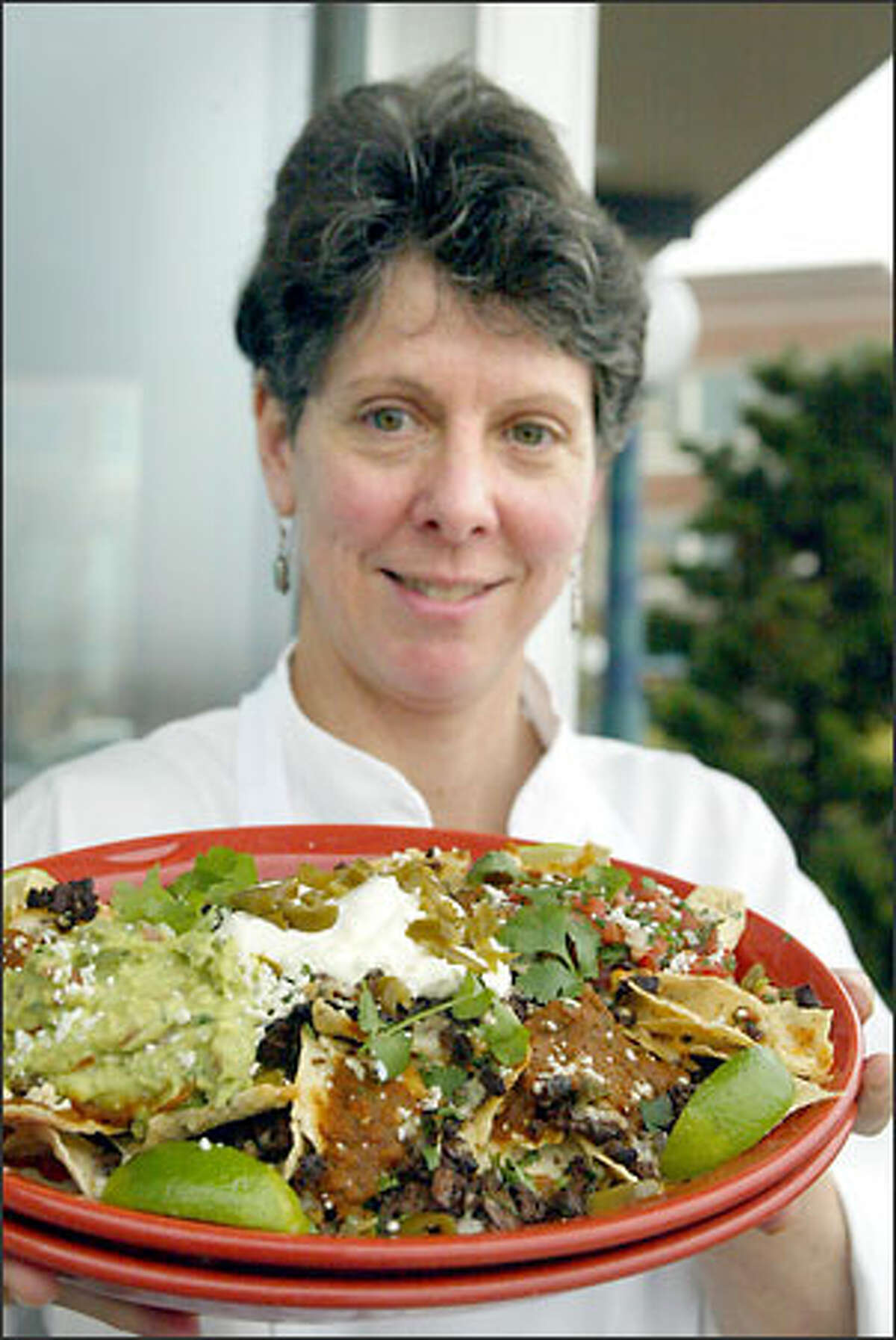 Yarrow Bay Grill's Vicky McCaffree scores a touchdown for East with her American Kobe Beef Nachos, served with sides of salsa, sour cream and guacamole.