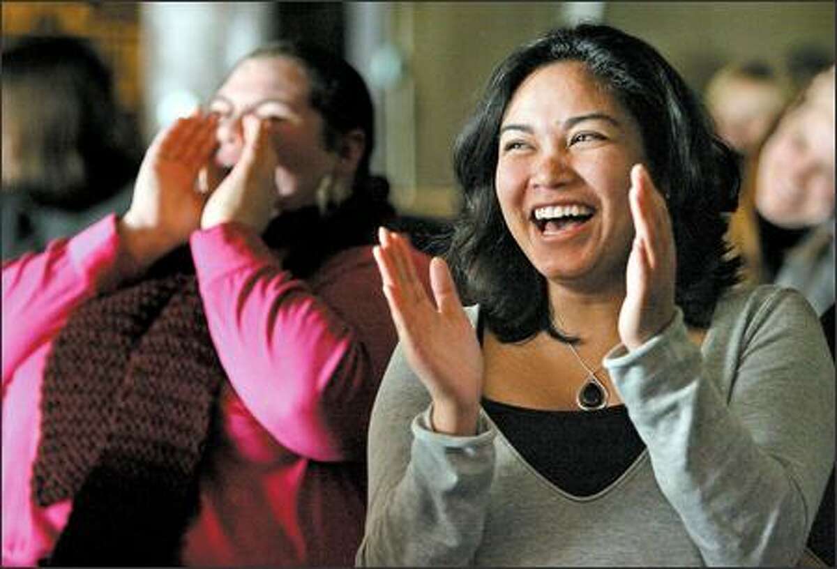 Mary Lawlon cheers and Chantra Siv claps during Non-Profit Night at the Comedy Underground. The events raised $14,000 for non-profits in 2006.