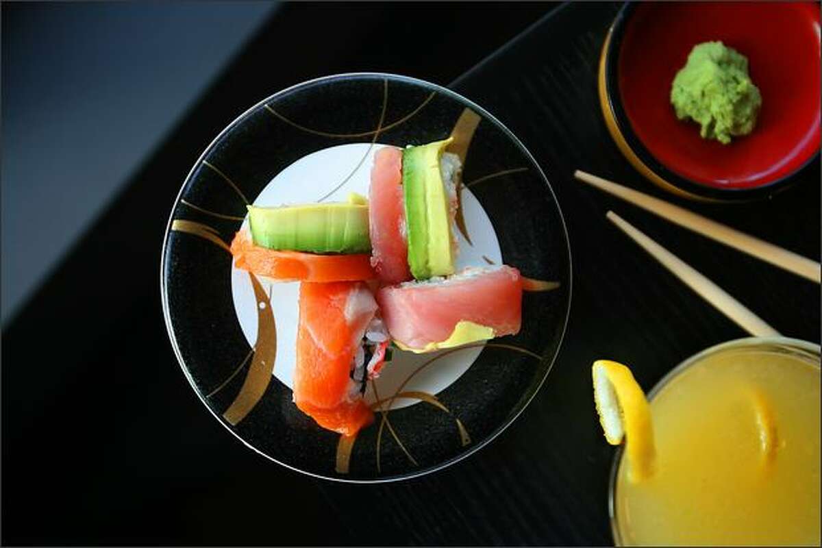 Rainbow roll, avocado, salmon and tuna sushi is served with Shanghai lemon drop.