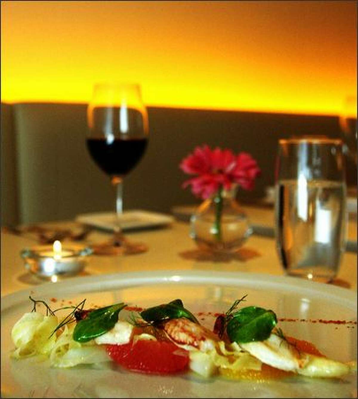 A white asparagus salad neatly arranges the vegetables with finger lengths of Dungeness crabmeat and perfectly peeled citrus segments.