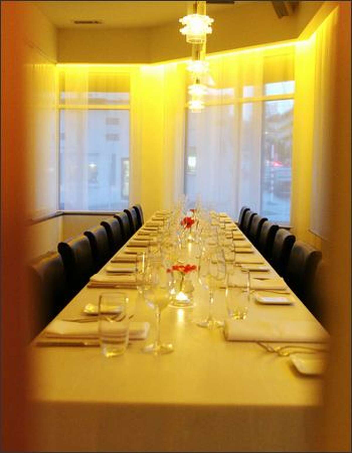 The raised communal table at Veil seems custom-fit for a bridal party. The gauzy curtains further evoke the theme.