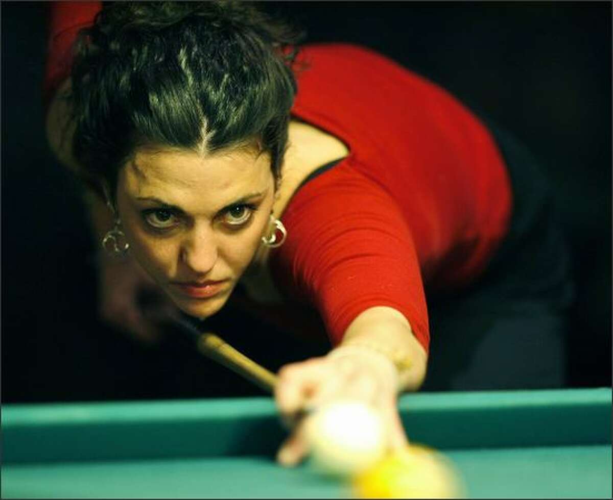 Vixens player Alicia Kelley, of Kirkland, lines up her shot during one of the group’s “Gauntlet” tournaments at The Parlor Billiards in Bellevue.
