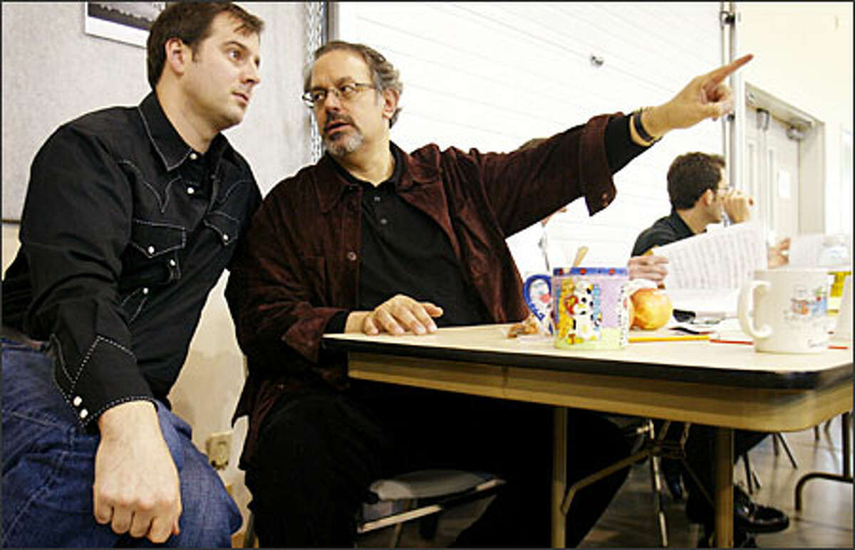 "A director has to be everything, knowing when to apply pressure and when to let up," says "Norma" director Peter Kazaras, center, shown talking with set designer Curtis Wallin.