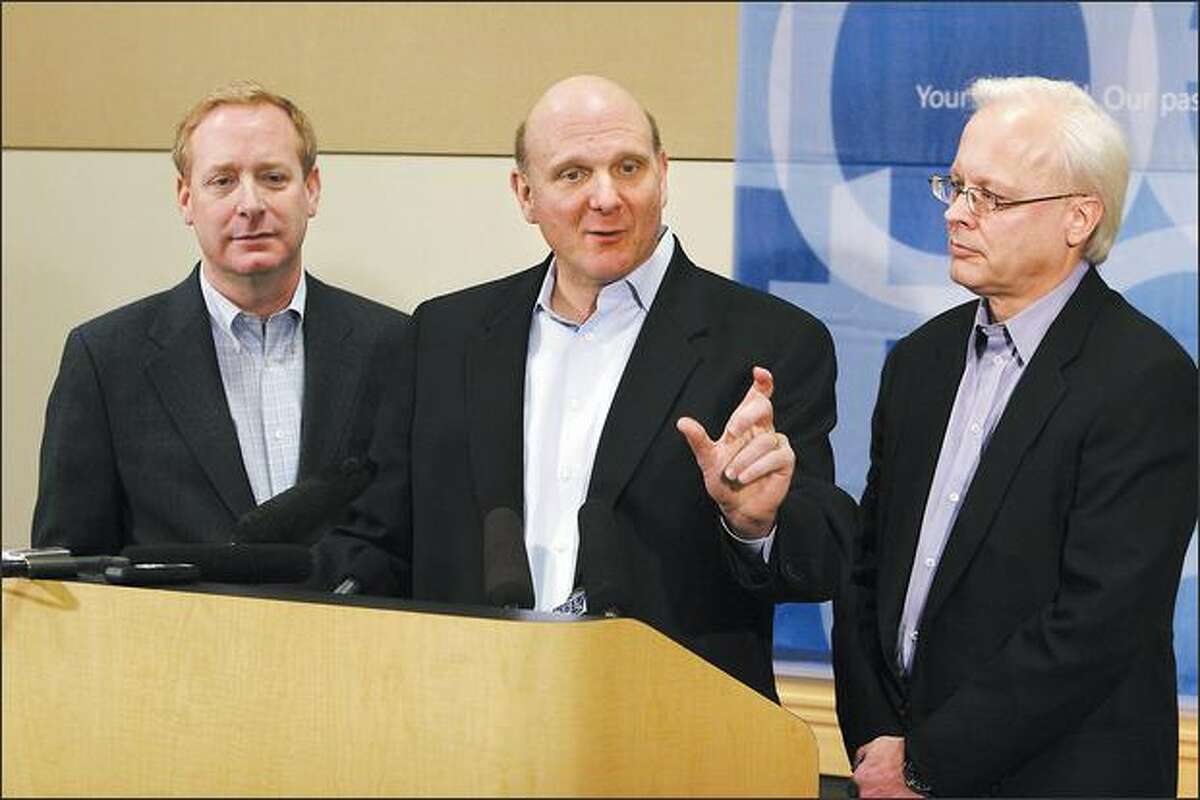 Microsoft Chief Executive Officer Steve Ballmer, center, General Counsel Brad Smith, left, and Chief software architect Ray Ozzie, answer questions during a press conference on February 21, 2008 at Microsoft's Redmond, Wash. campus, about their announcement to make strategic changes in their practices to expand interoperability.
