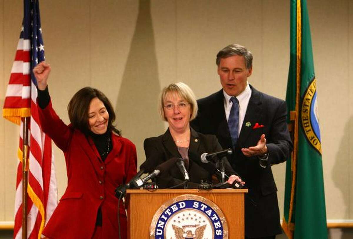 From left, U.S. Senator Maria Cantwell, U.S. Senator Patty Murray and U.S. Rep. Jay Inslee celebrate after Boeing was awarded a $35 billion tanker contract for the U.S. Air Force.