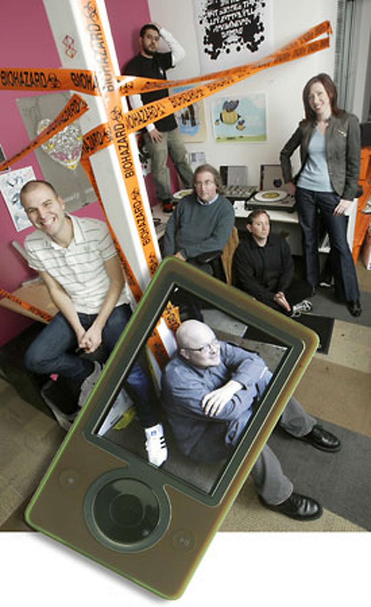 Zune Marketplace editorial team: Paul Pearson, in Zune. Behind him, from left, Kyle Hopkins, Omid Fatemi, Jon Kertzer, Andy Kessler and Emily Griffin.