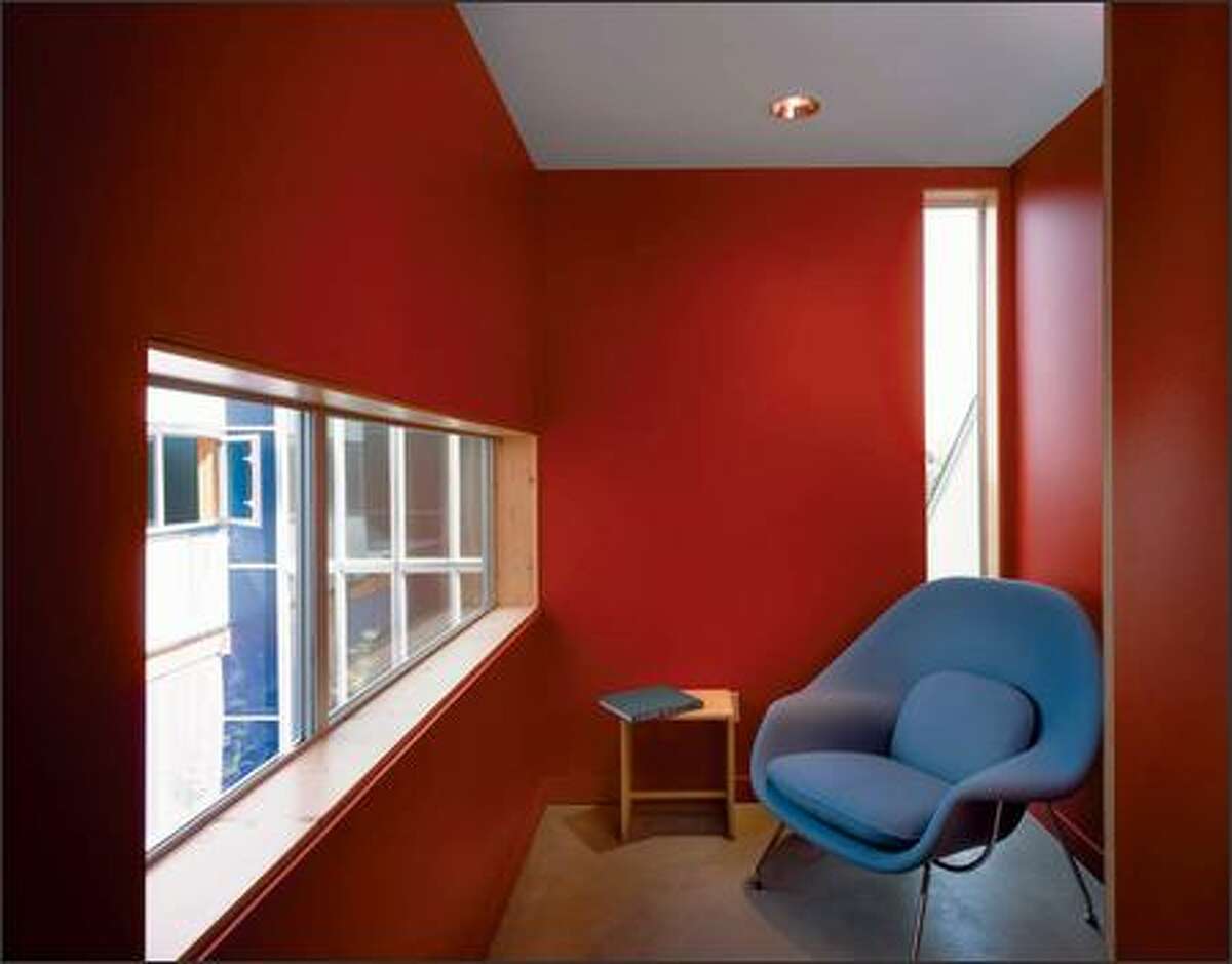 Each unit has small, boldly painted rooms that challenge the residents to discover their uses.