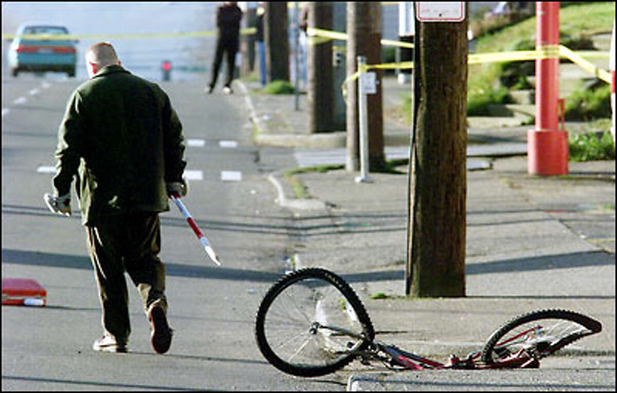The bicycle being ridden by Joel Robert Silvesan was knocked about 50 yards, landing across Aurora, after being hit by Patrolman Chris Hansen's car.