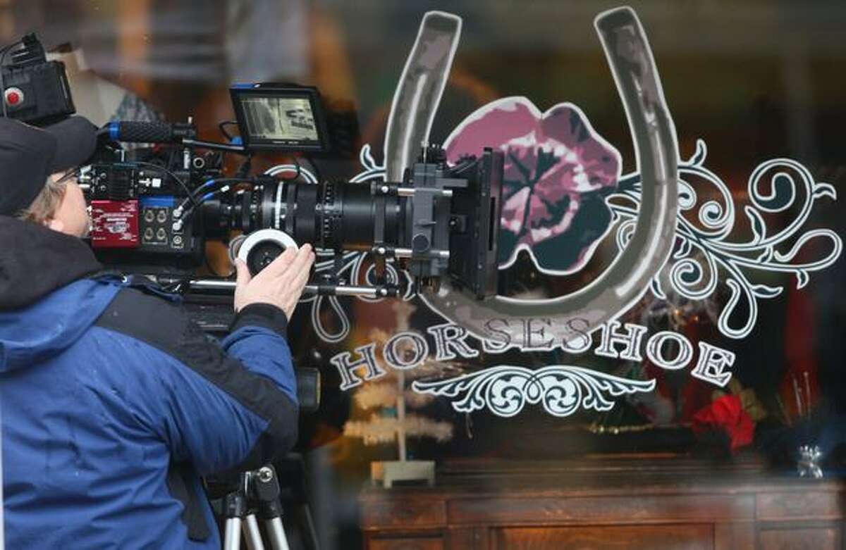 A camera crew shoots a scene during filming of the movie "Late Autumn" along Ballard Avenue Northwest on Jan. 14.