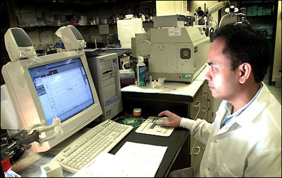 Gerry Castillo, ProteoTech's director of biochemistry, records data while working on the company's developmental drug to treat Alzheimer's.