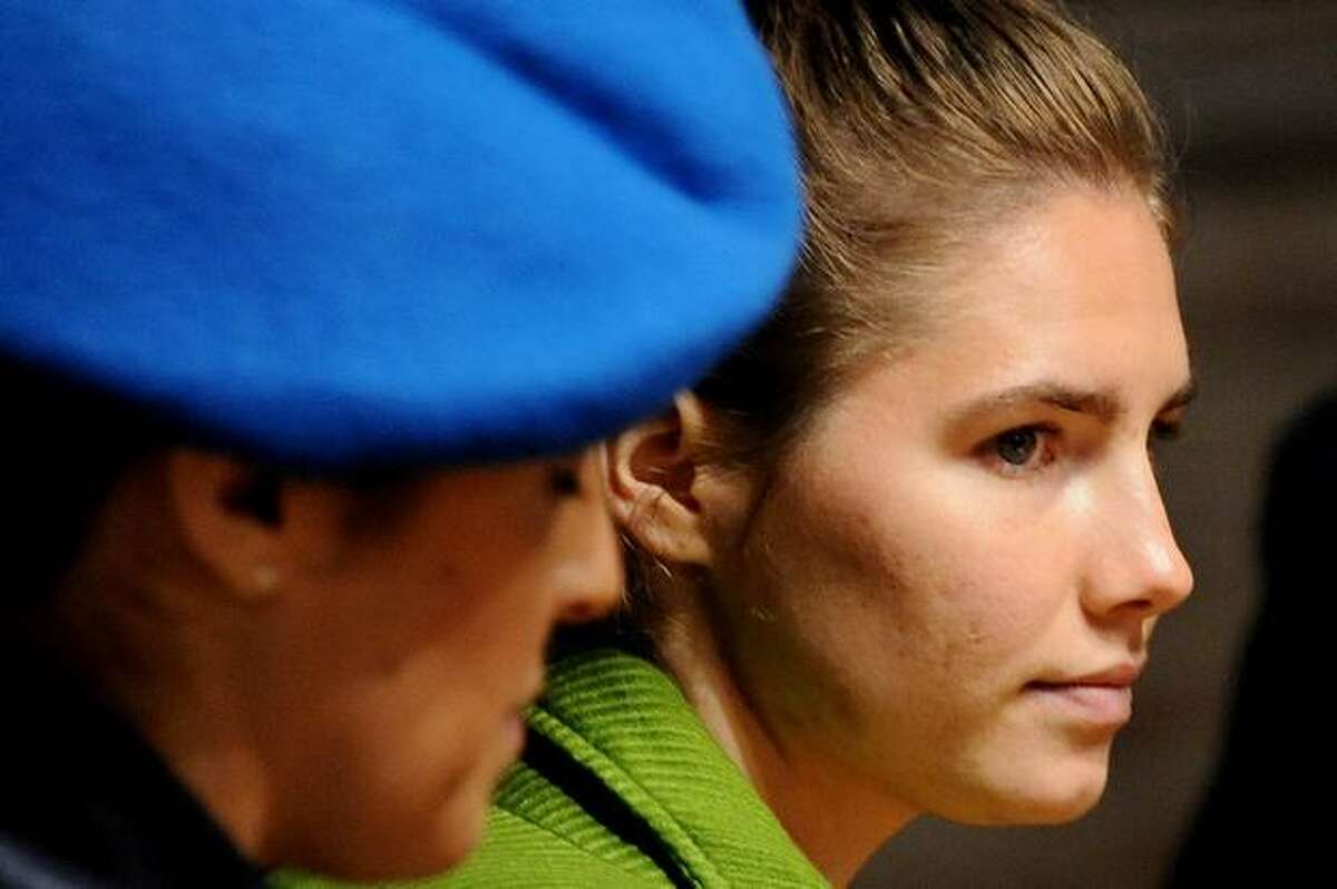 U.S. student Amanda Knox, accused of taking part in the killing of British student Meredith Kercher in 2007, looks on during a session of her trial on December 4, 2009 at the courthouse in Perugia, Italy.