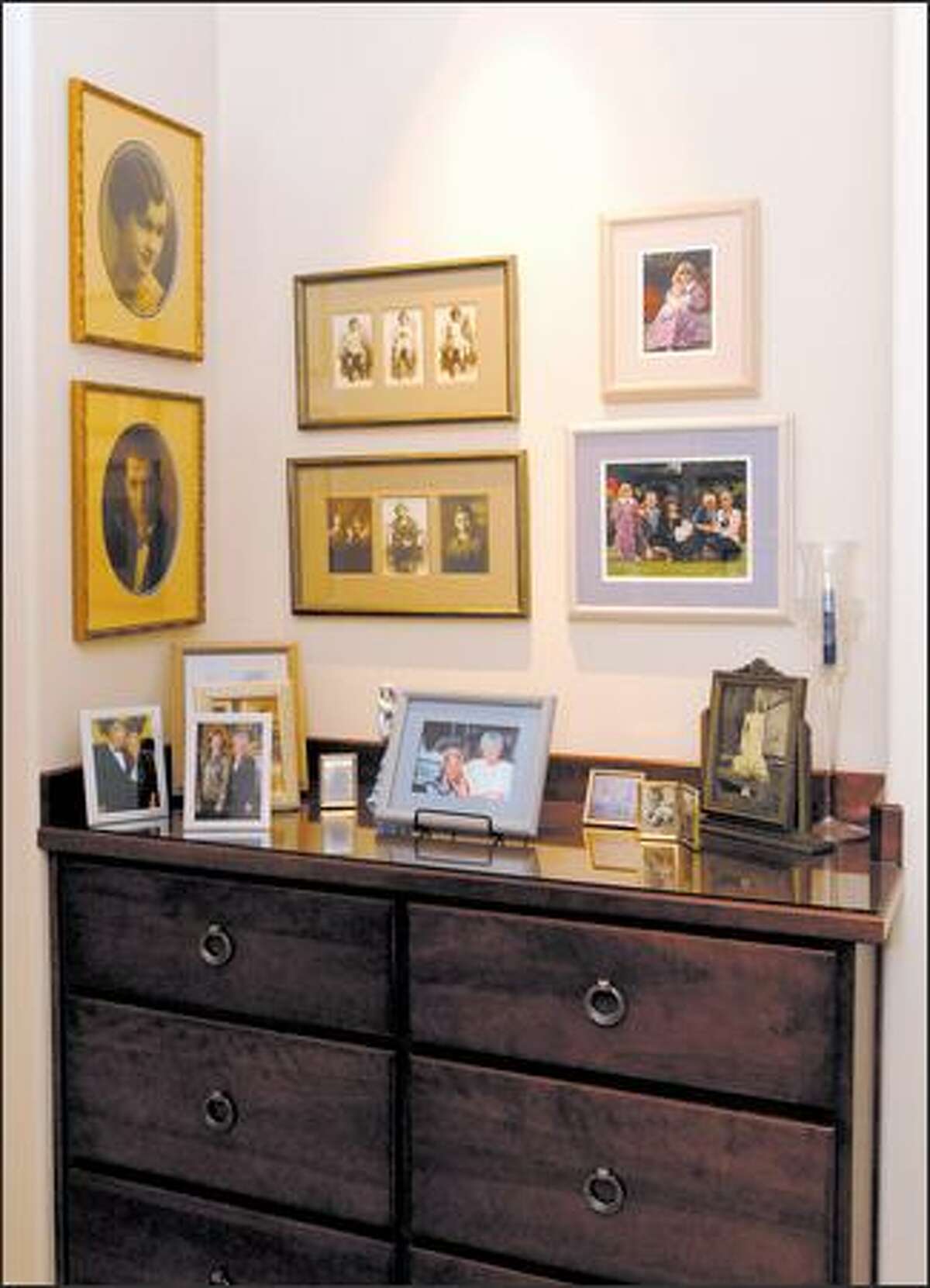 Group pictures according to frames, style and content, says John Willis, owner of Amiker Designs & Custom Framing.