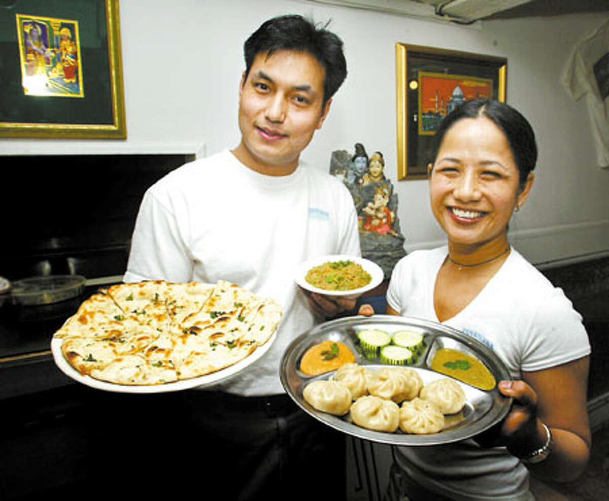 Bharta dip, left, and Tensing momo are favorites at the Annapurna Cafe, owned by brother and sister Kumar, left and Roshita Shreshta. The momos also are available in spinach.