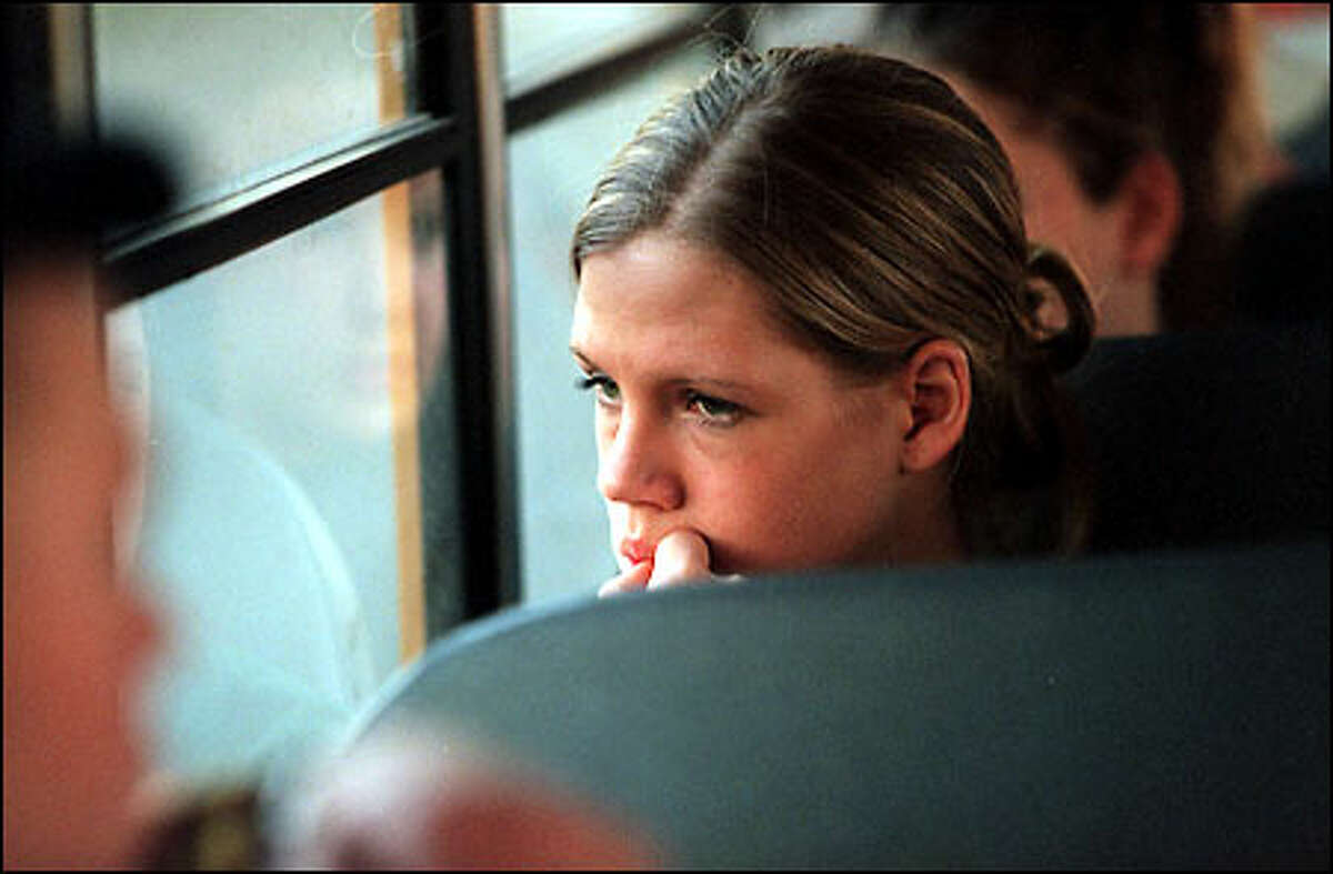 Brooke McCully, a guard for the Enumclaw Hornets, looks out the window of the school bus as her team rides to the Tacoma Dome for a walkabout late Tuesday afternoon.