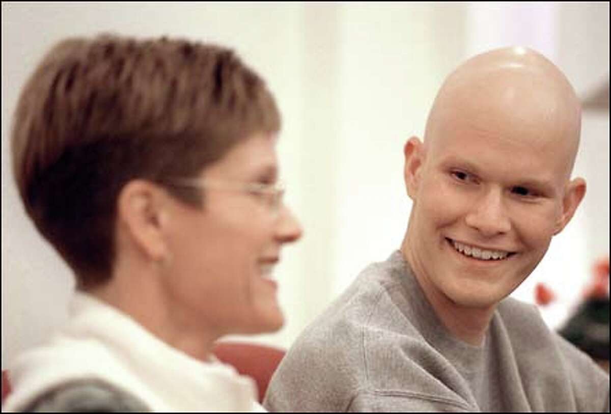 Gabe Solbrack, 18, a cancer patient from Kennewick, shares a laugh with his mother, Missi Solbrack, while visiting the new Gilda's Club. They moved to Seattle to be close to Children's Hospital for Solbrack's treatments.
