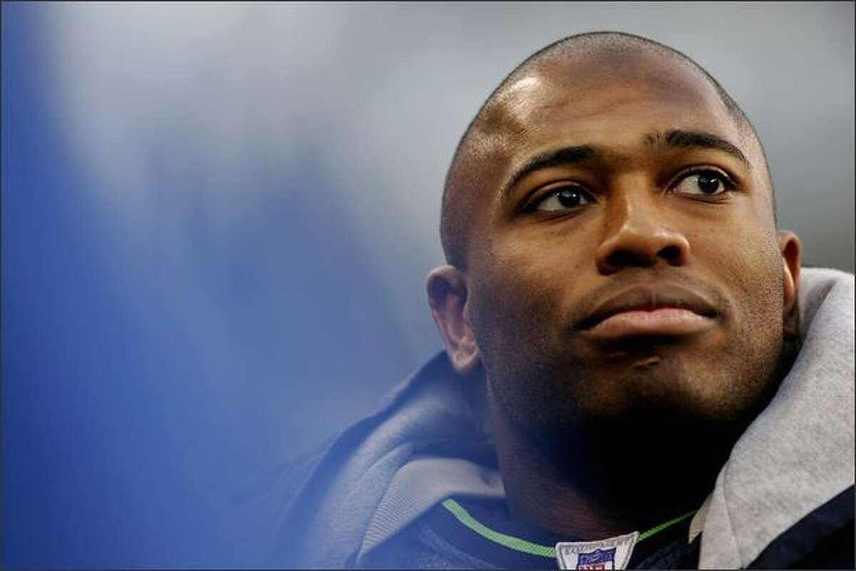 Shaun Alexander #37 of the Seattle Seahawks looks at the scoreboard during a 41-3 victory over the San Francisco 49ers on December 11, 2005 at Qwest Field in Seattle Washington.