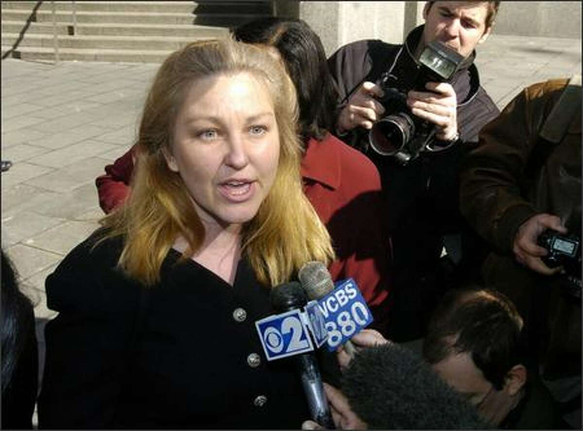 Susan Lindauer speaks to the media outside Manhattan federal court in New York. The one time journalist and congressional aide is accused of secretly becoming an Iraqi intelligence agent. (AP Photo/ Richard Drew)