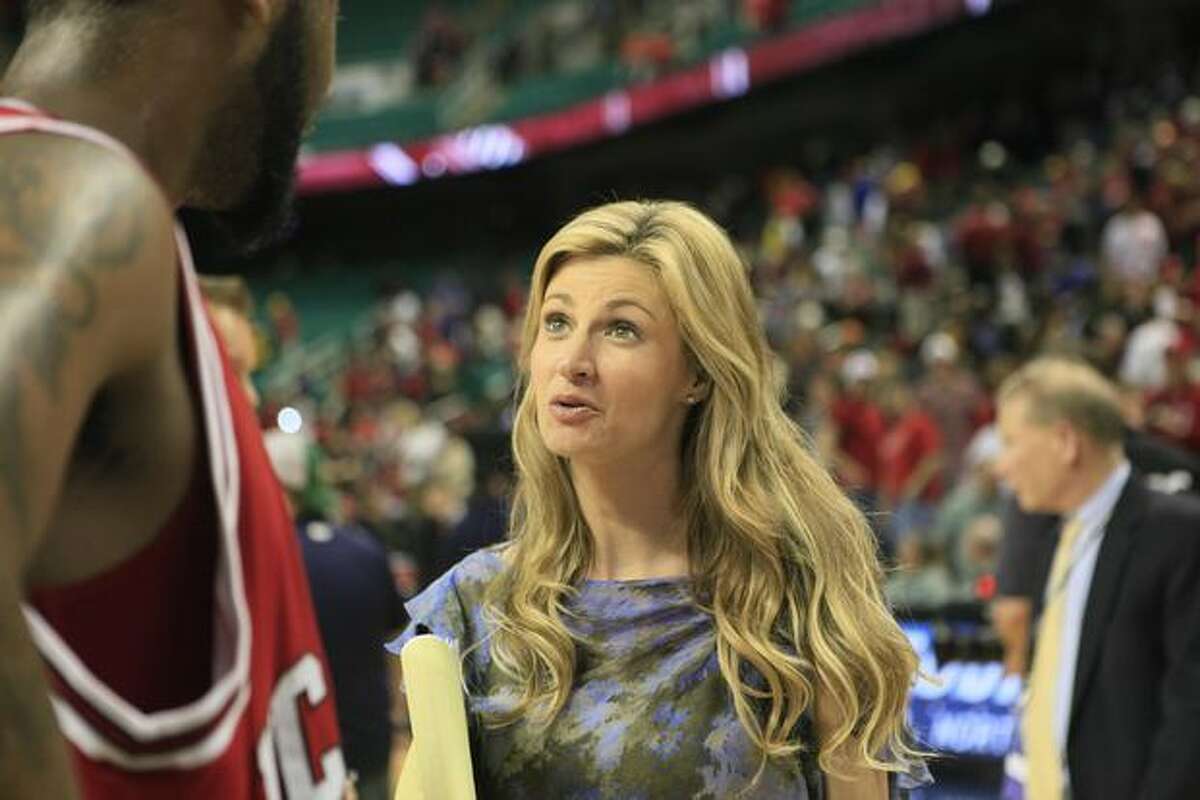 This photo made last Friday shows ESPN sportscaster Erin Andrews interviewing North Carolina State's Tracy Smith after a college basketball game at the Atlantic Coast Conference tournament in Greensboro, N.C. The man convicted of stalking Andrews and shooting nude videos of her through a hotel room peephole was sentenced Monday to 2 1/2 years in prison. (AP Photo/Gerry Broome)