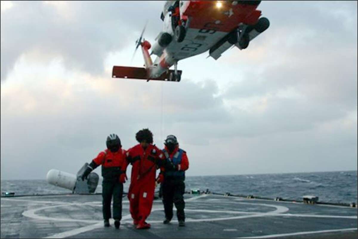 A crew member of the Alaska Ranger is taken on board the Coast Guard Cutter Munro. The Alaska Ranger began taking on water 120 miles west of Dutch Harbor.