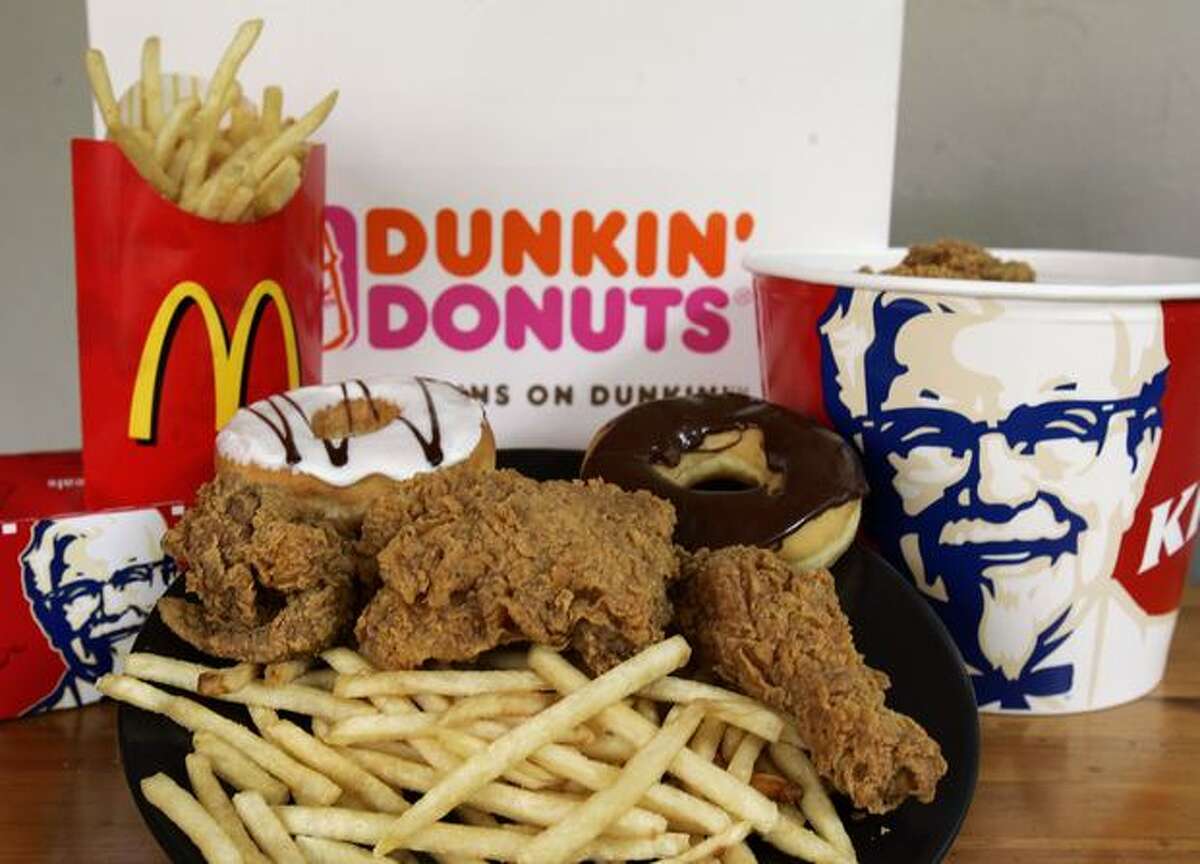 Doughnuts from Dunkin' Donuts, French fries from McDonalds and fried chicken from Kentucky Fried Chicken are displayed in this September 2006 file photo.