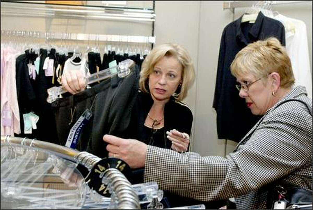 Lynn Mahlum helps Linda Capato with buying a new outfit at Southcenter Nordstrom. Mahlum sold more than $1 million in merchandise at the store last year.