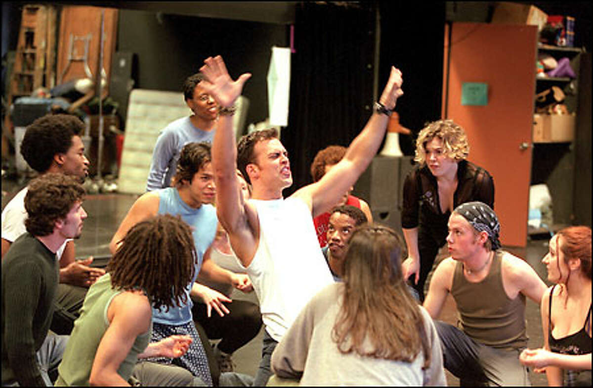 The cast of "Hair" rehearses at the Seattle Center. The show runs from May 30 to June 23 in Seattle before moving on to New York.