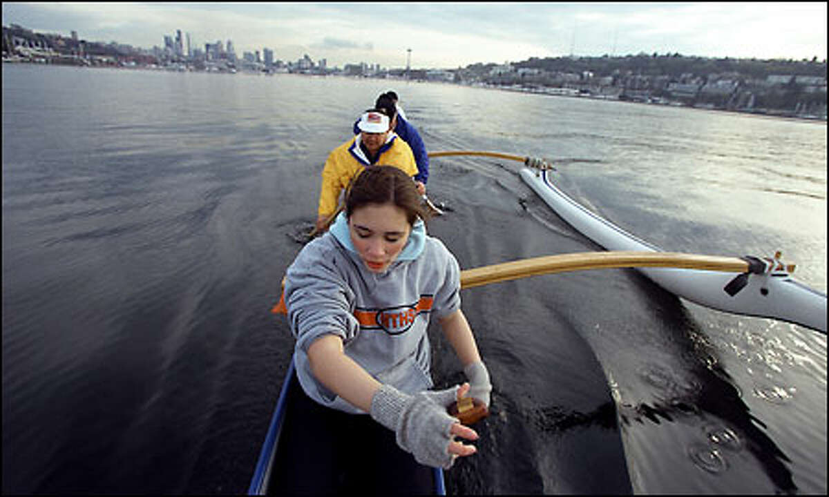 Members of the Hawaiian Outrigger Club "Hui Wa'ao Wakinikona" paddle on Lake Union during a recent workout. In front is 16-year-old Keola Awana.